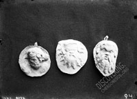 Three heads of old Sileni